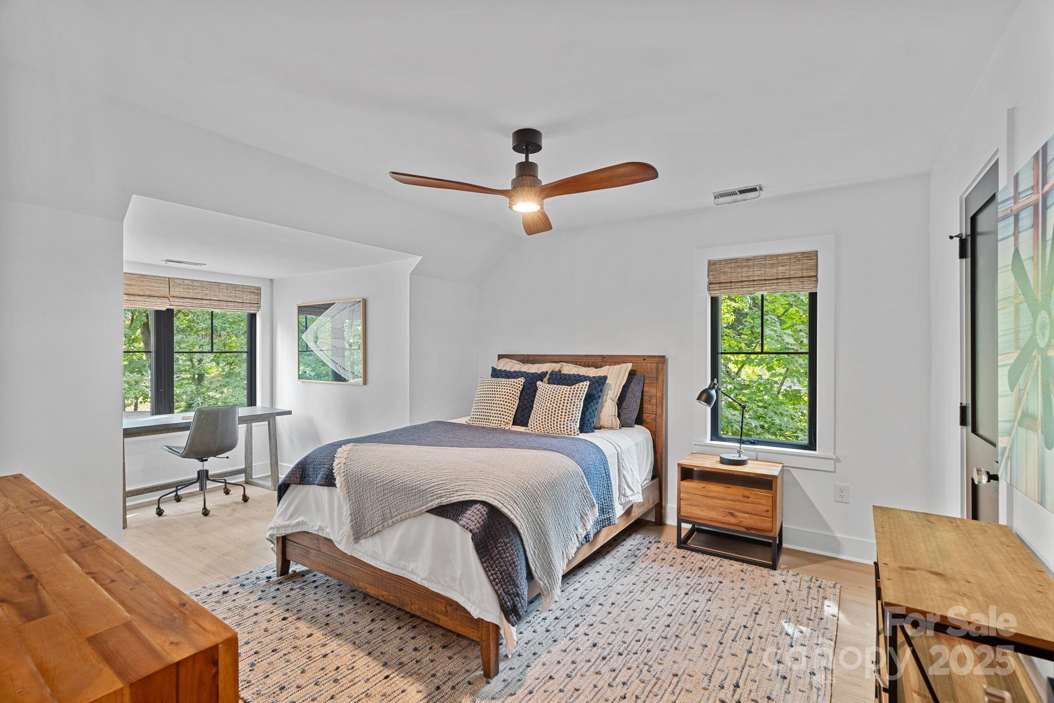 19624 Meta Road Cornelius, NC 28031 - Photo 31 of 44 a bedroom with a bed a couch and a window