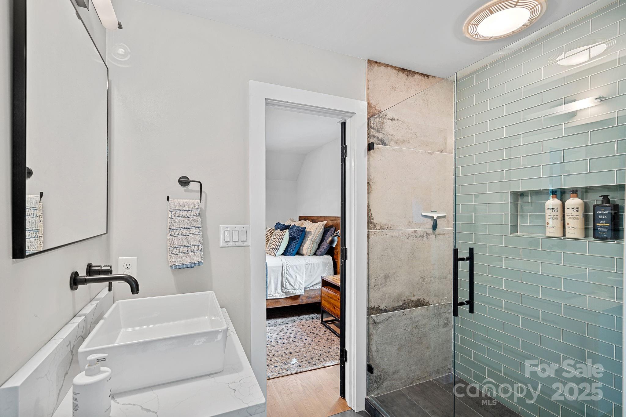 19624 Meta Road Cornelius, NC 28031 - Photo 32 of 44 a bathroom with a tub and a shower