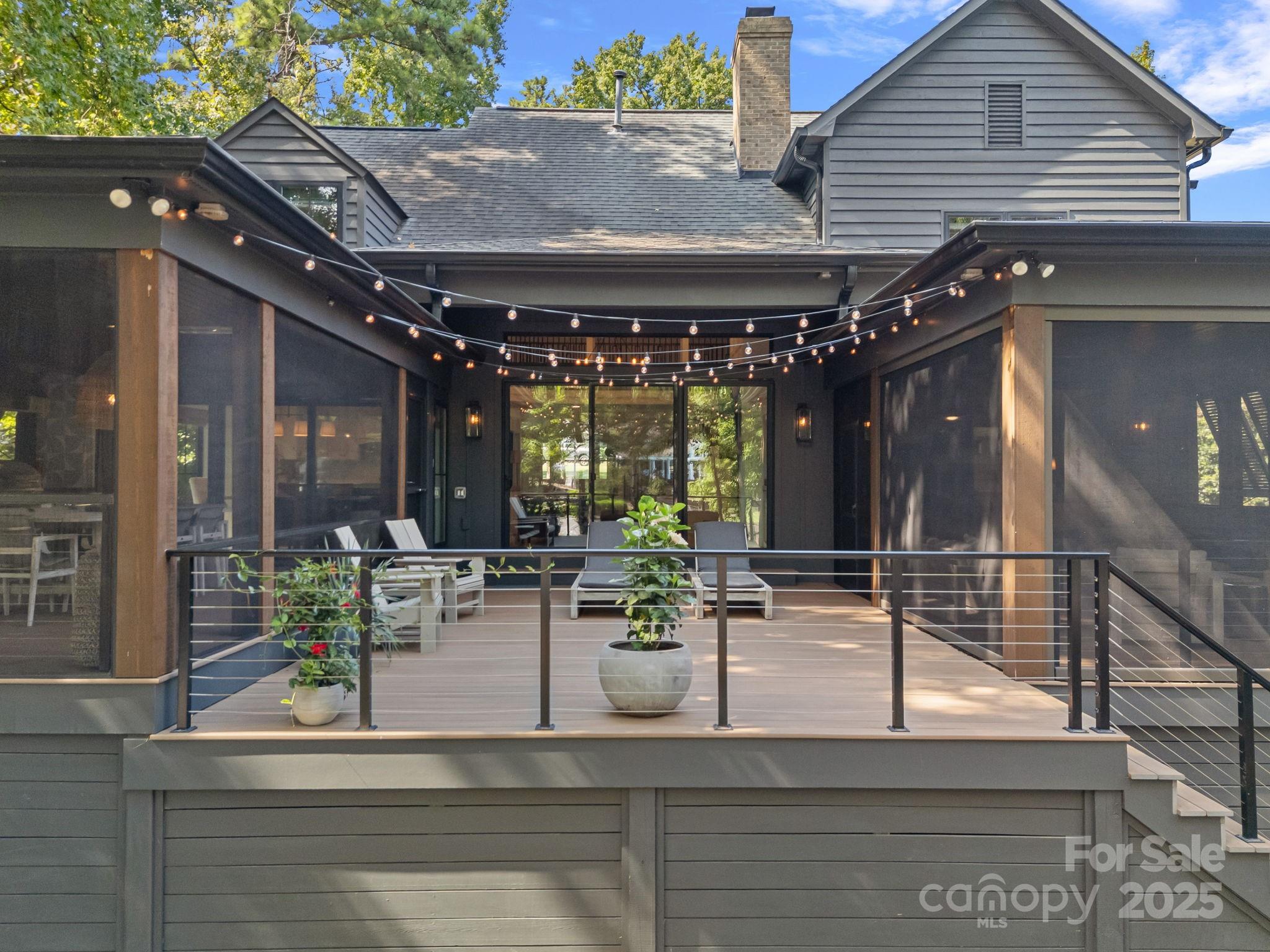 19624 Meta Road Cornelius, NC 28031 - Photo 38 of 44 a view of a patio with table and chairs and potted plants