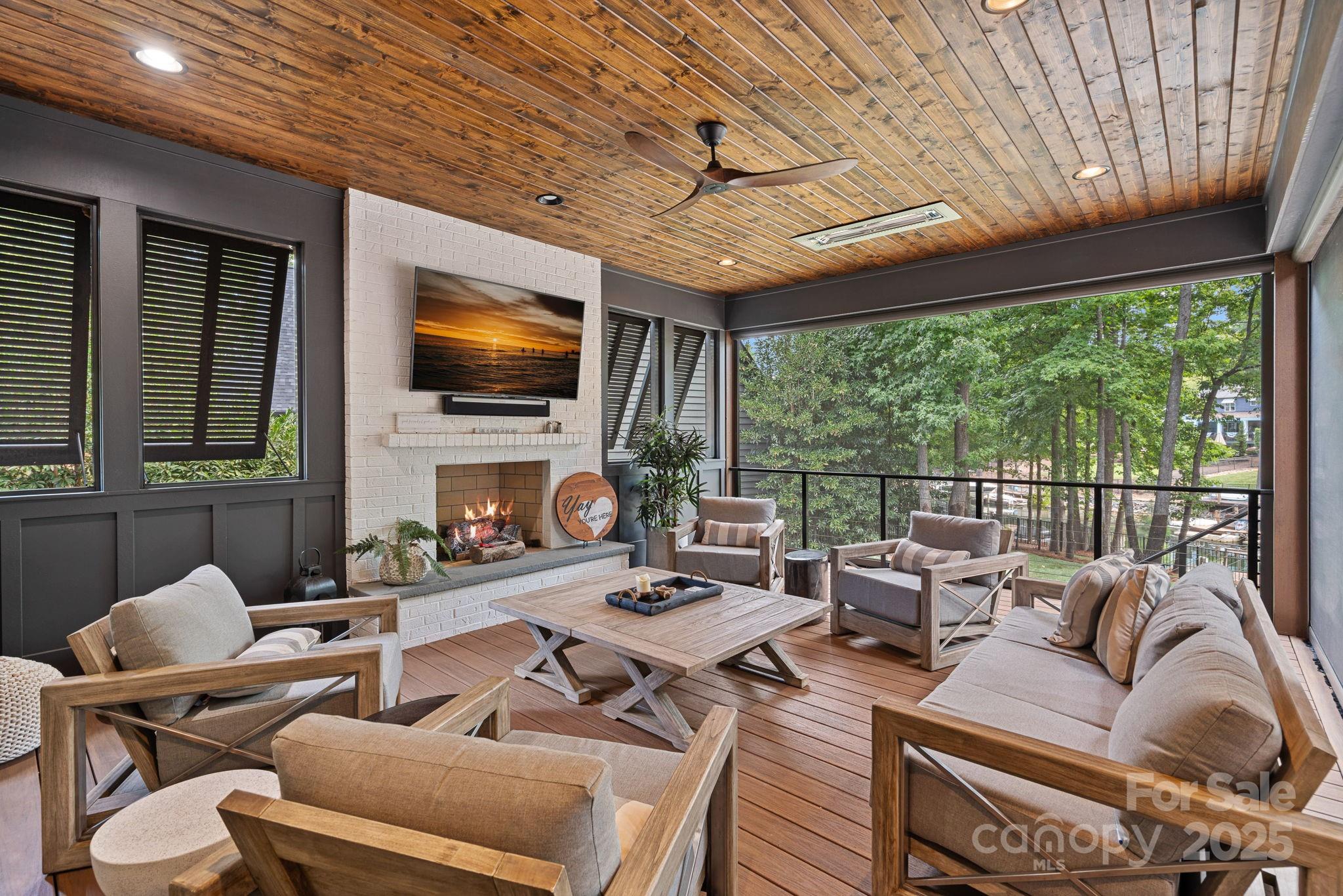 19624 Meta Road Cornelius, NC 28031 - Photo 39 of 44 a living room with furniture fireplace and a flat screen tv