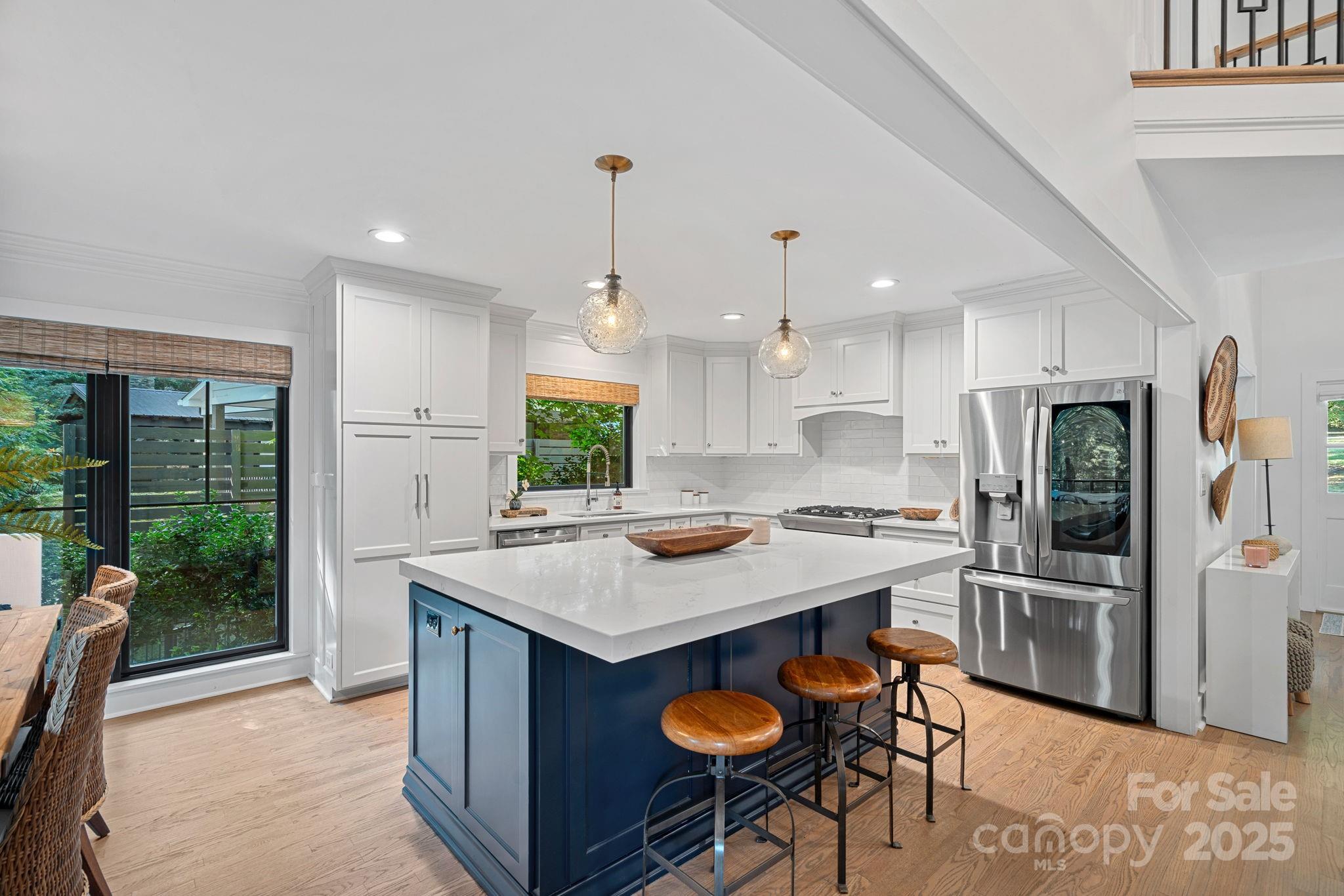 19624 Meta Road Cornelius, NC 28031 - Photo 8 of 44 a kitchen with stainless steel appliances granite countertop a stove top oven a refrigerator and a sink
