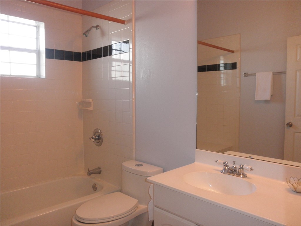 109 West 38th Street, Unit A Austin, TX 78705 - Photo 11 of 16 a bathroom with a sink toilet and shower