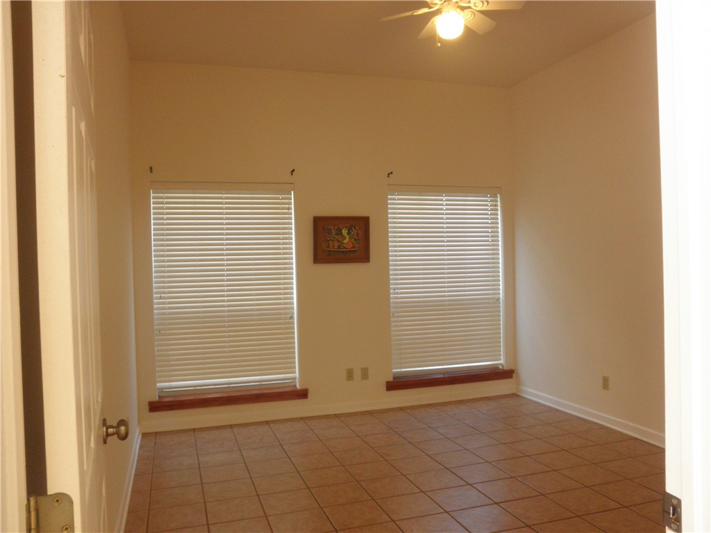 109 West 38th Street, Unit A Austin, TX 78705 - Photo 5 of 16 a view of an empty room with window and cabinet area