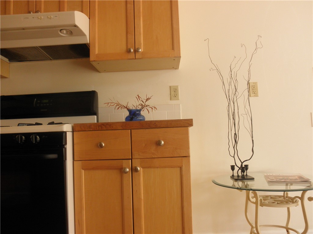 109 West 38th Street, Unit A Austin, TX 78705 - Photo 7 of 16 a kitchen with a sink and cabinets