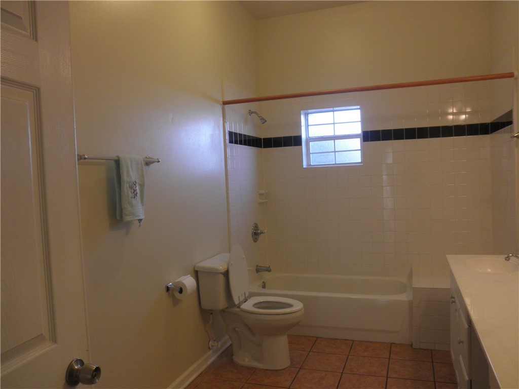 109 West 38th Street, Unit A Austin, TX 78705 - Photo 10 of 16 a bathroom with a toilet and a shower