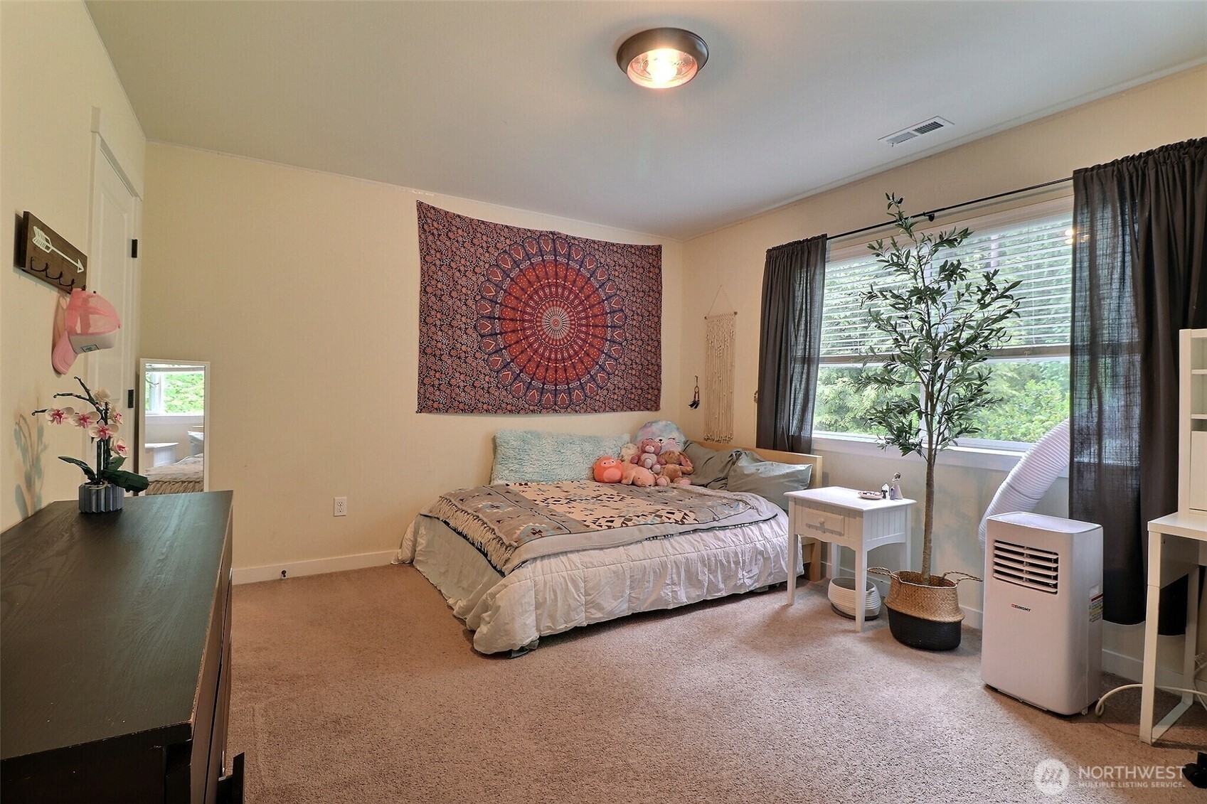 19776 Mountain Ridge Road Southeast Monroe, WA 98272 - Photo 26 of 40 a spacious bedroom with a bed and a large window
