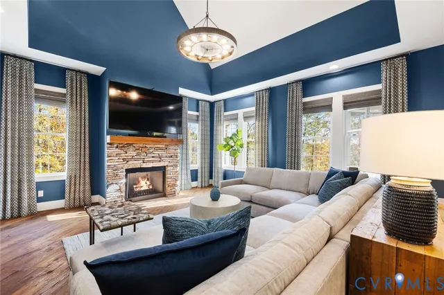 a kitchen with granite countertop a sink cabinets and wooden floor