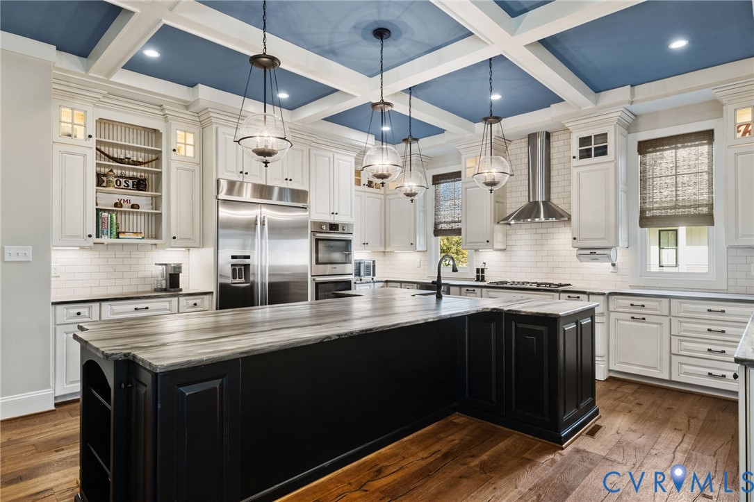 16118 Old Castle Road Midlothian, VA 23112 - Photo 18 of 50 a kitchen with stainless steel appliances granite countertop a sink and wooden cabinets