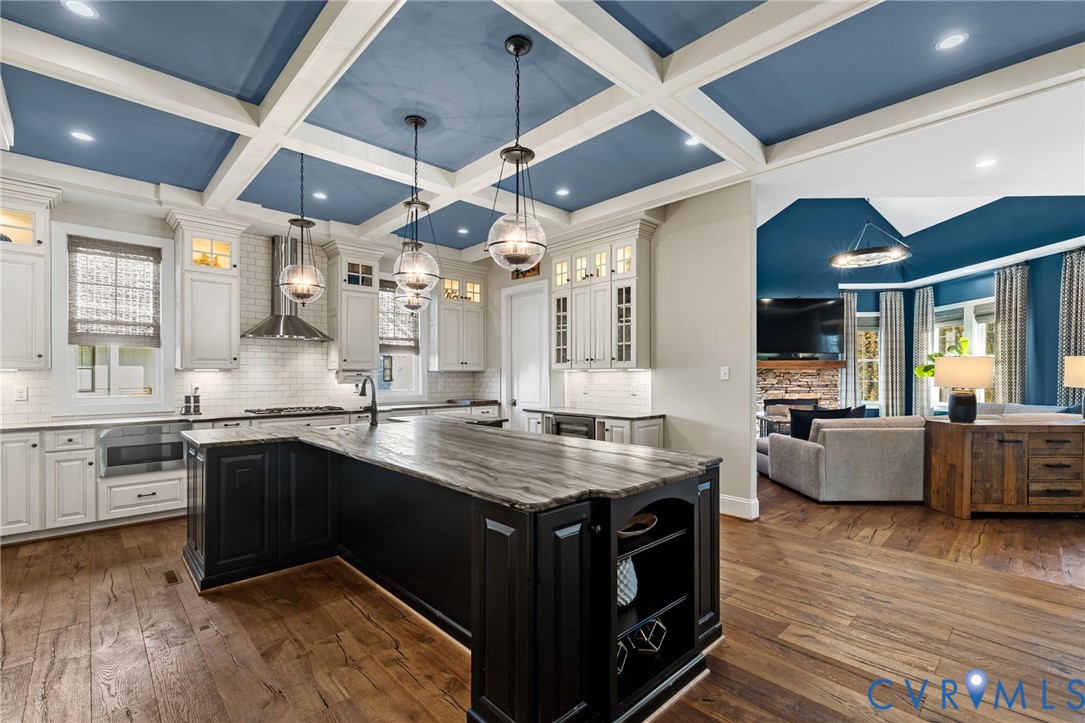 16118 Old Castle Road Midlothian, VA 23112 - Photo 20 of 50 a kitchen with granite countertop a sink cabinets and wooden floor