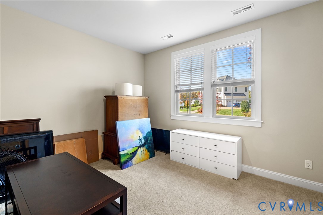 16118 Old Castle Road Midlothian, VA 23112 - Photo 31 of 50 a bedroom with a bed and a desk