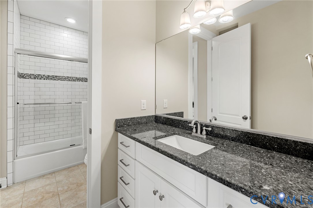 16118 Old Castle Road Midlothian, VA 23112 - Photo 32 of 50 a bathroom with a granite countertop sink a toilet and shower