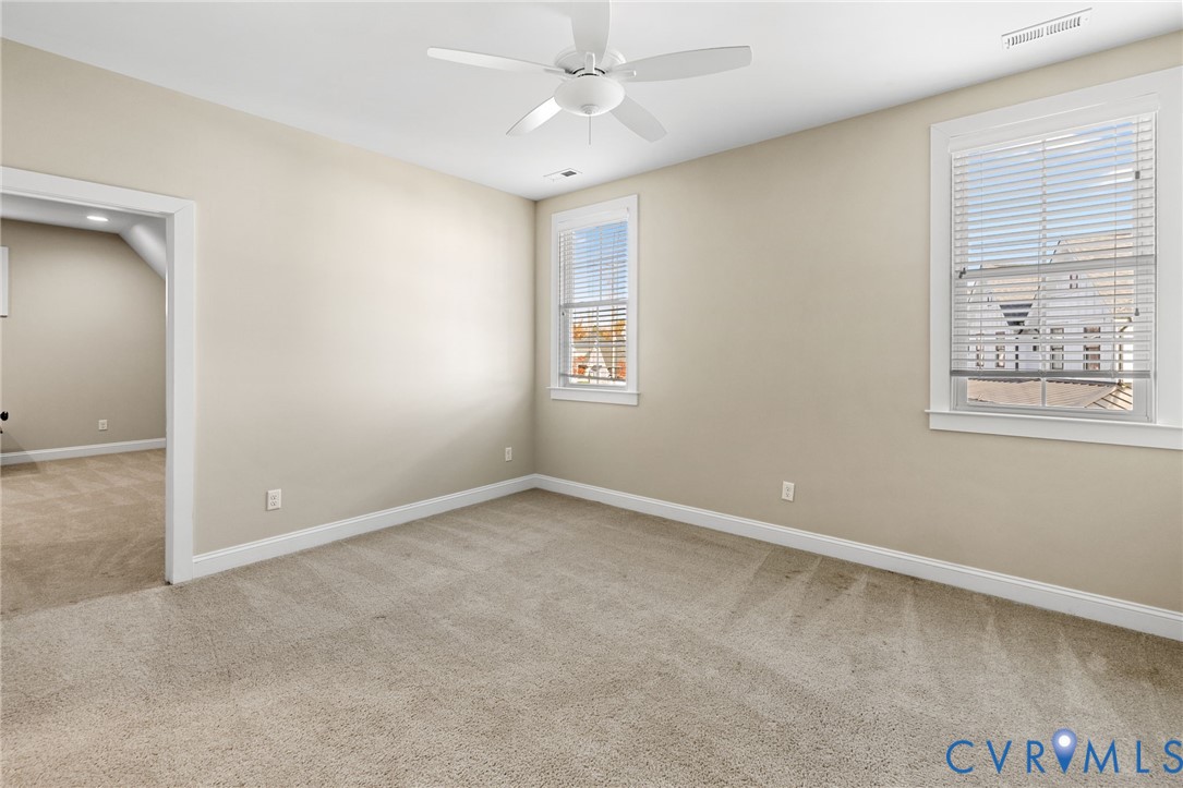 16118 Old Castle Road Midlothian, VA 23112 - Photo 33 of 50 an empty room with windows and fan