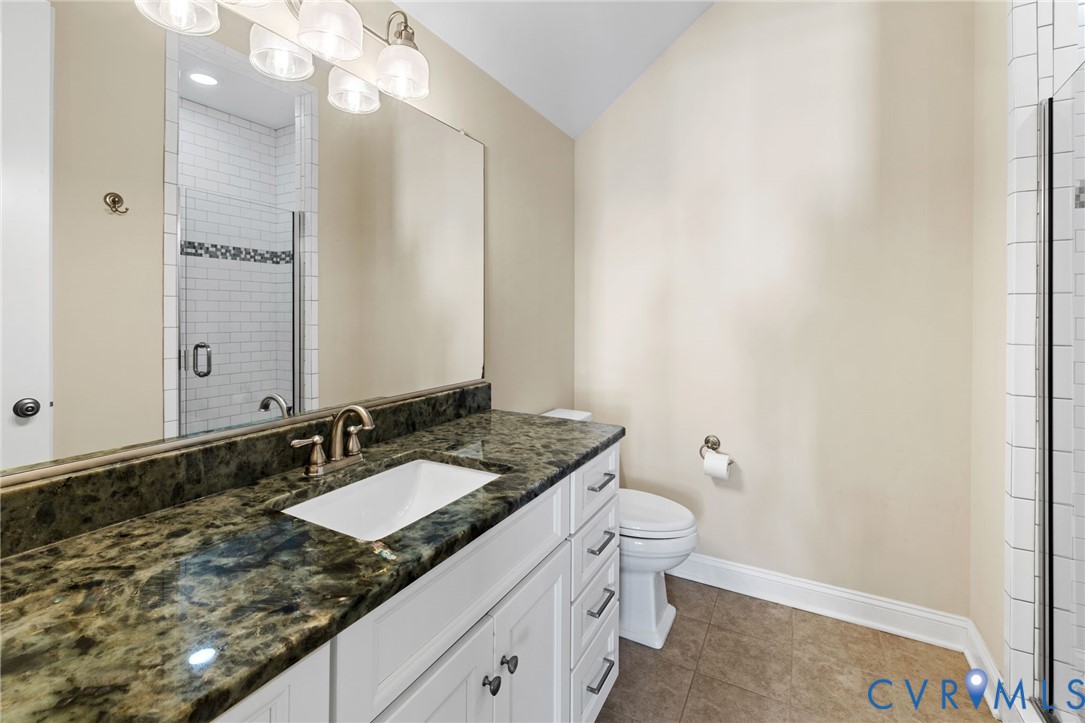 16118 Old Castle Road Midlothian, VA 23112 - Photo 37 of 50 a bathroom with a granite countertop sink a toilet and a mirror