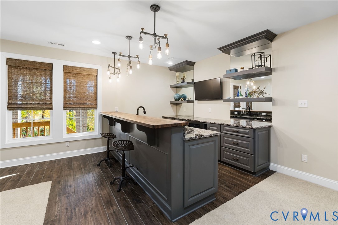 16118 Old Castle Road Midlothian, VA 23112 - Photo 39 of 50 a kitchen with stainless steel appliances granite countertop a stove and a refrigerator