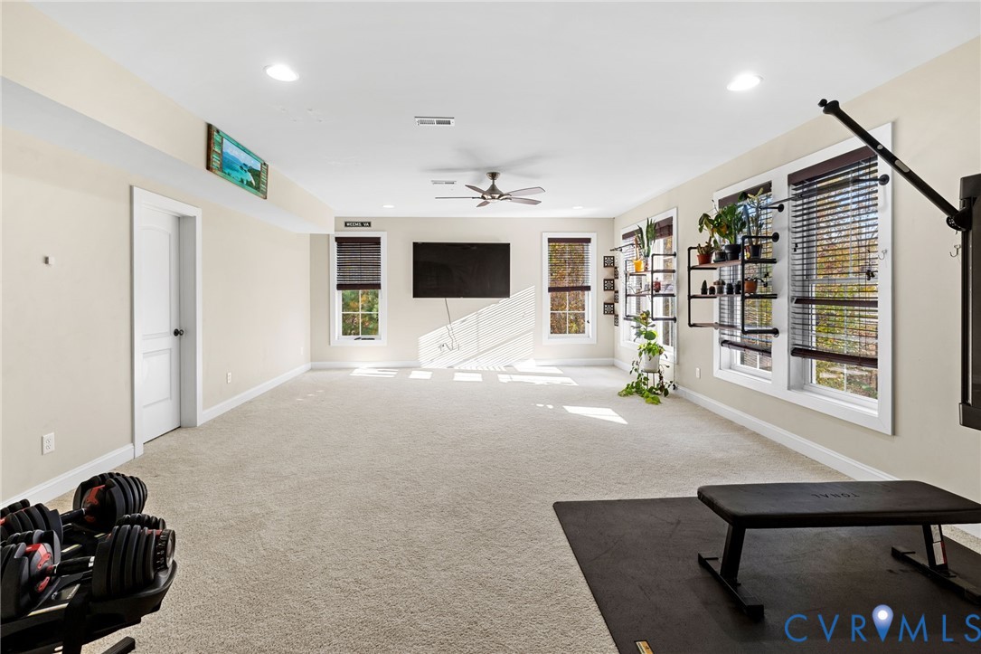 16118 Old Castle Road Midlothian, VA 23112 - Photo 41 of 50 a living room with furniture and a flat screen tv