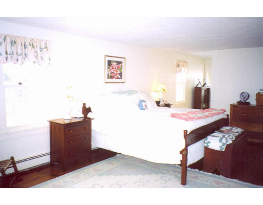 94 Kettle Hole Road Bolton, MA 01740 - Photo 2 of 5 a bed room with a bed mirror and a desk