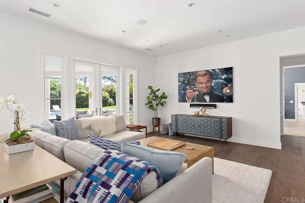 6531 Mimulus Rancho Santa Fe, CA 92067 - Photo 13 of 15 a living room with furniture a flat screen tv and a large window