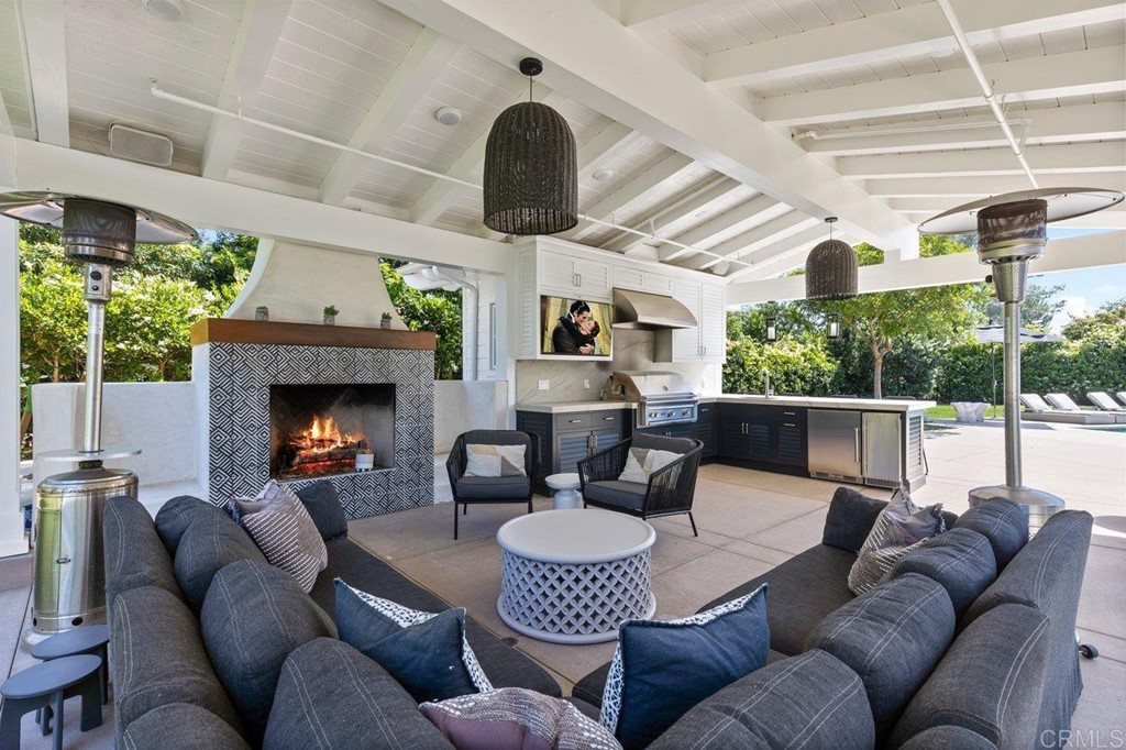 6531 Mimulus Rancho Santa Fe, CA 92067 - Photo 5 of 15 a living room with furniture and a fireplace