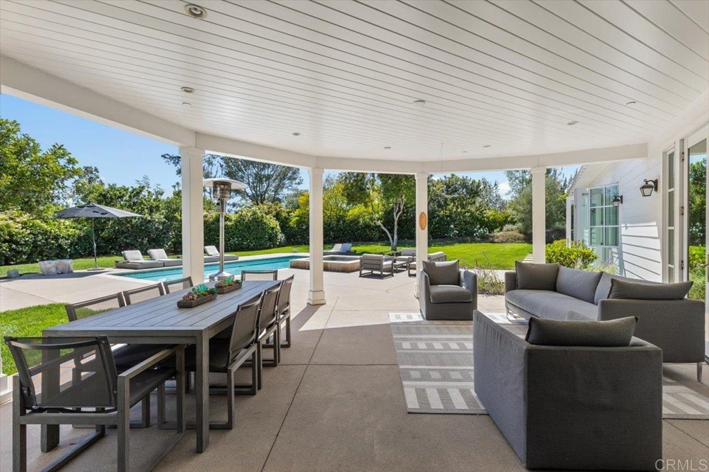 6531 Mimulus Rancho Santa Fe, CA 92067 - Photo 9 of 15 a view of a patio with a dining table and chairs