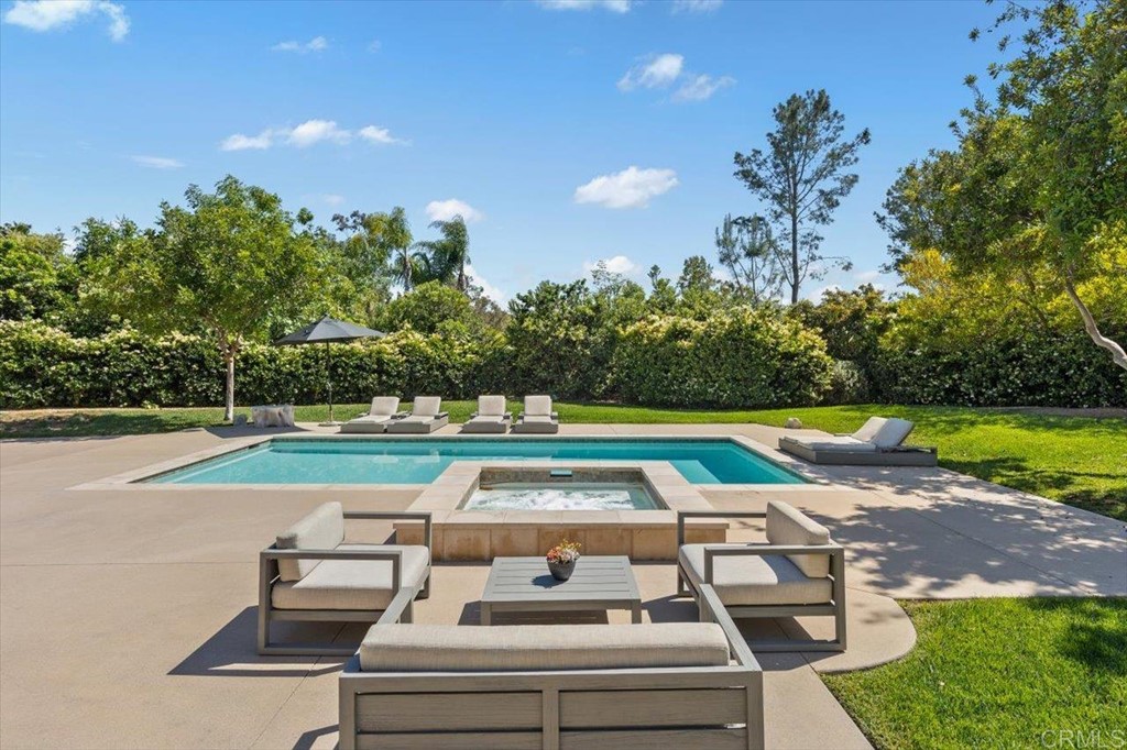 6531 Mimulus Rancho Santa Fe, CA 92067 - Photo 10 of 15 a view of a yard with table and chairs under an umbrella