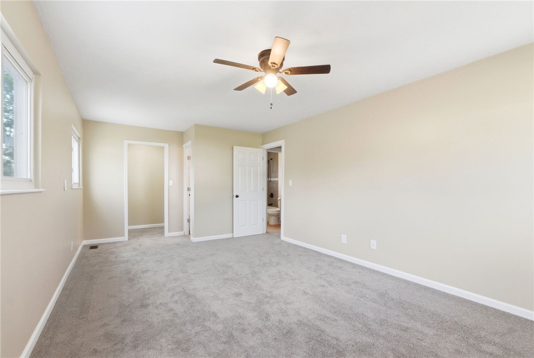 40 Woods Road Springboro, OH 45066 - Photo 54 of 57 Bright and airy, this bedroom offers a spacious retreat with soft carpeting and ample natural light.