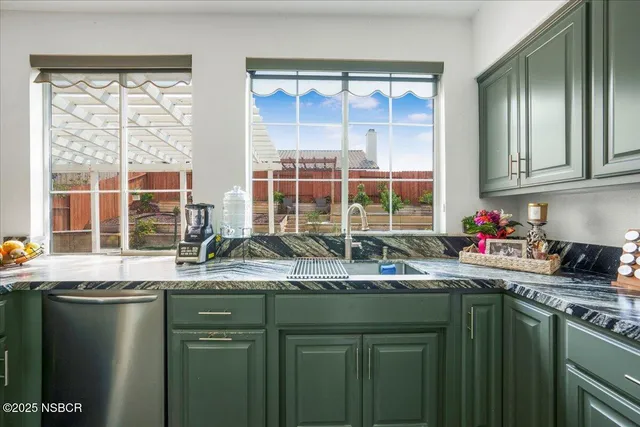 a kitchen with a sink and a window