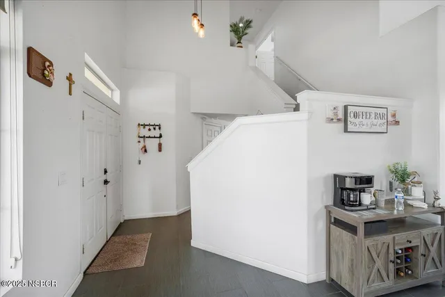 a utility room with cabinets washer and dryer