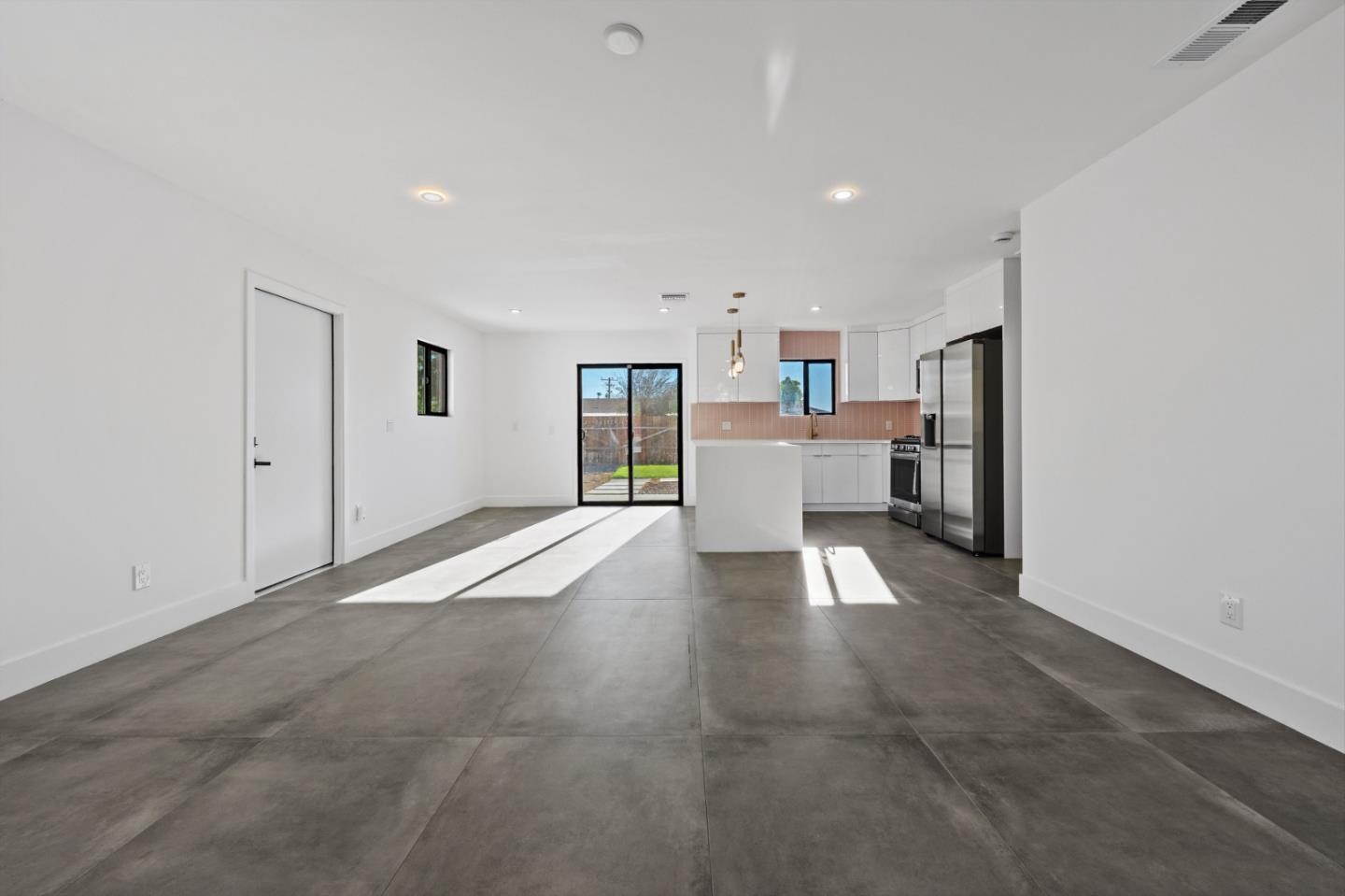 2600 North Chuperosa Road Palm Springs, CA 92262 - Photo 15 of 33 a view of a kitchen with furniture and a refrigerator