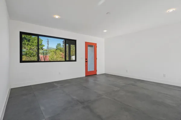 an empty room with large window