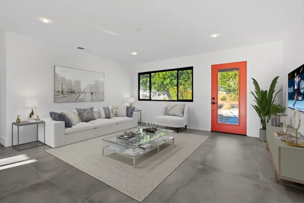 a living room with furniture and a window