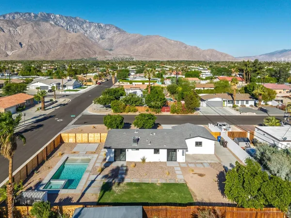 an aerial view of residential houses and outdoor space