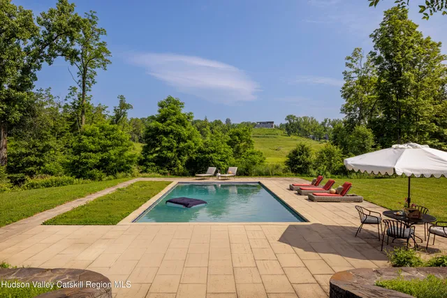 a view of swimming pool with lounge chair