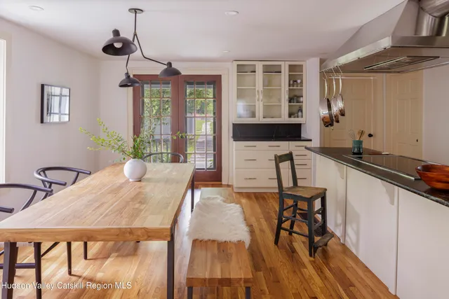 a view of a dining room with furniture window and outside view