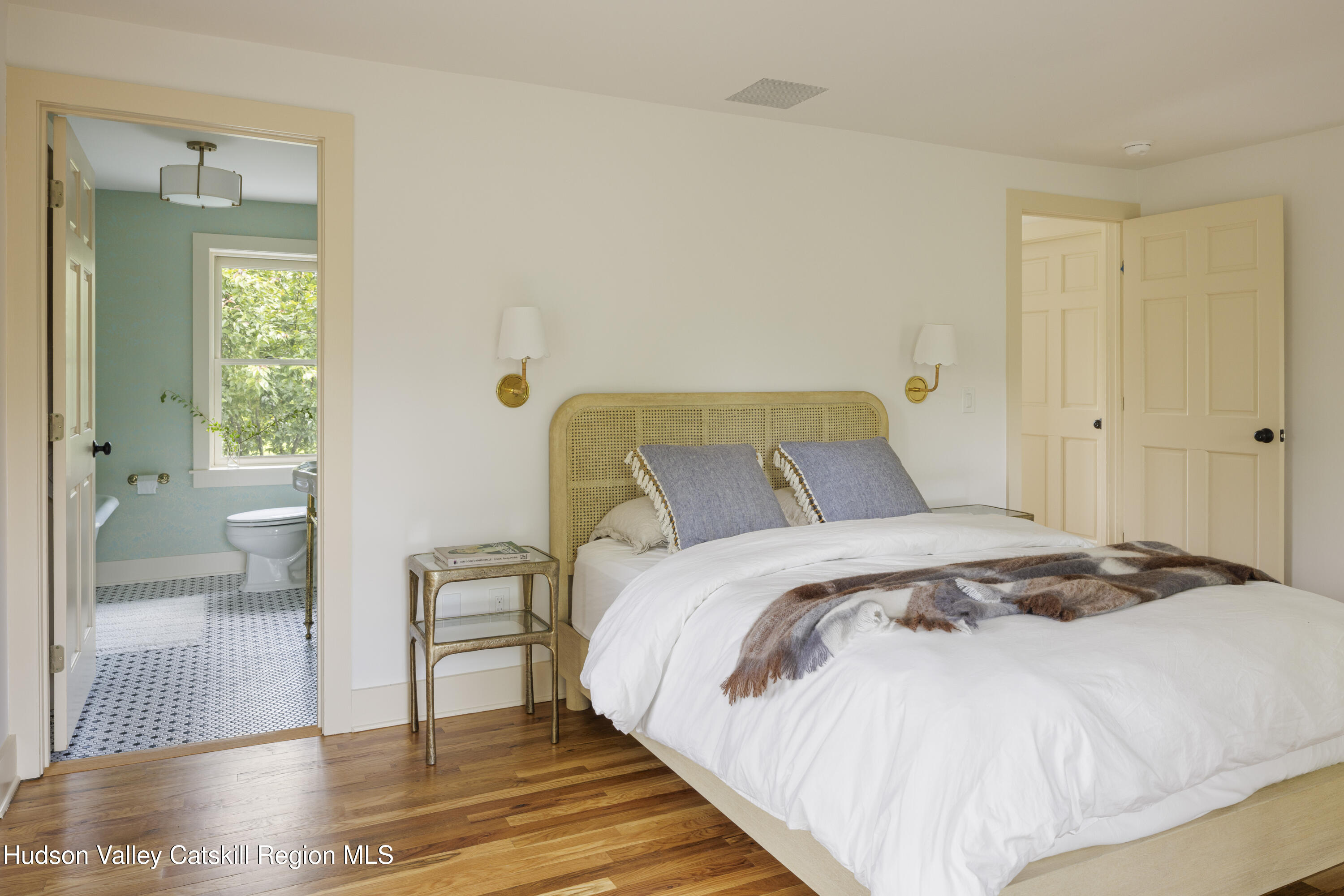 243 Morton Road Rhinebeck, NY 12572 - Photo 20 of 44 a bedroom with a bed and a view of bathroom