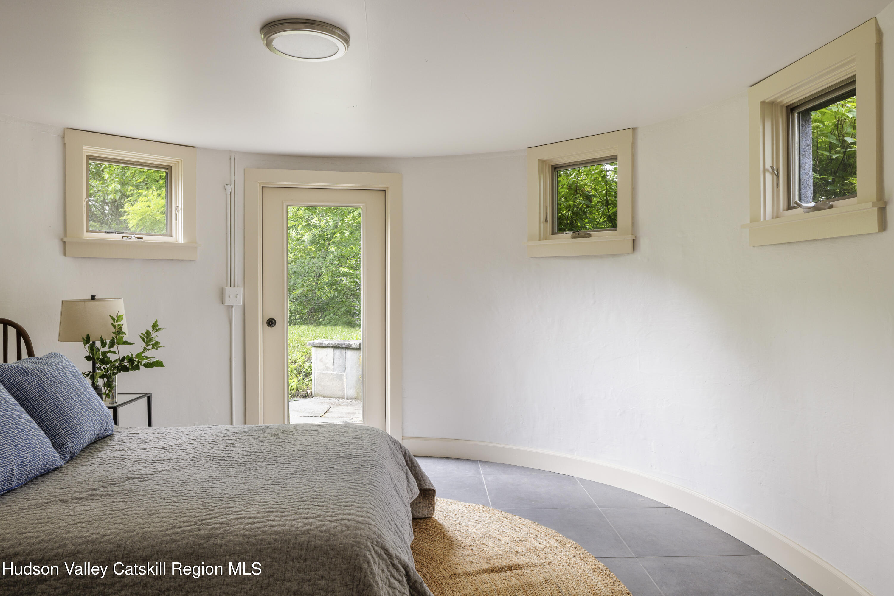 243 Morton Road Rhinebeck, NY 12572 - Photo 26 of 44 a bedroom with a bed and glass window