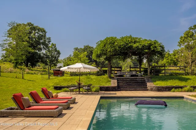 a view of swimming pool with outdoor seating