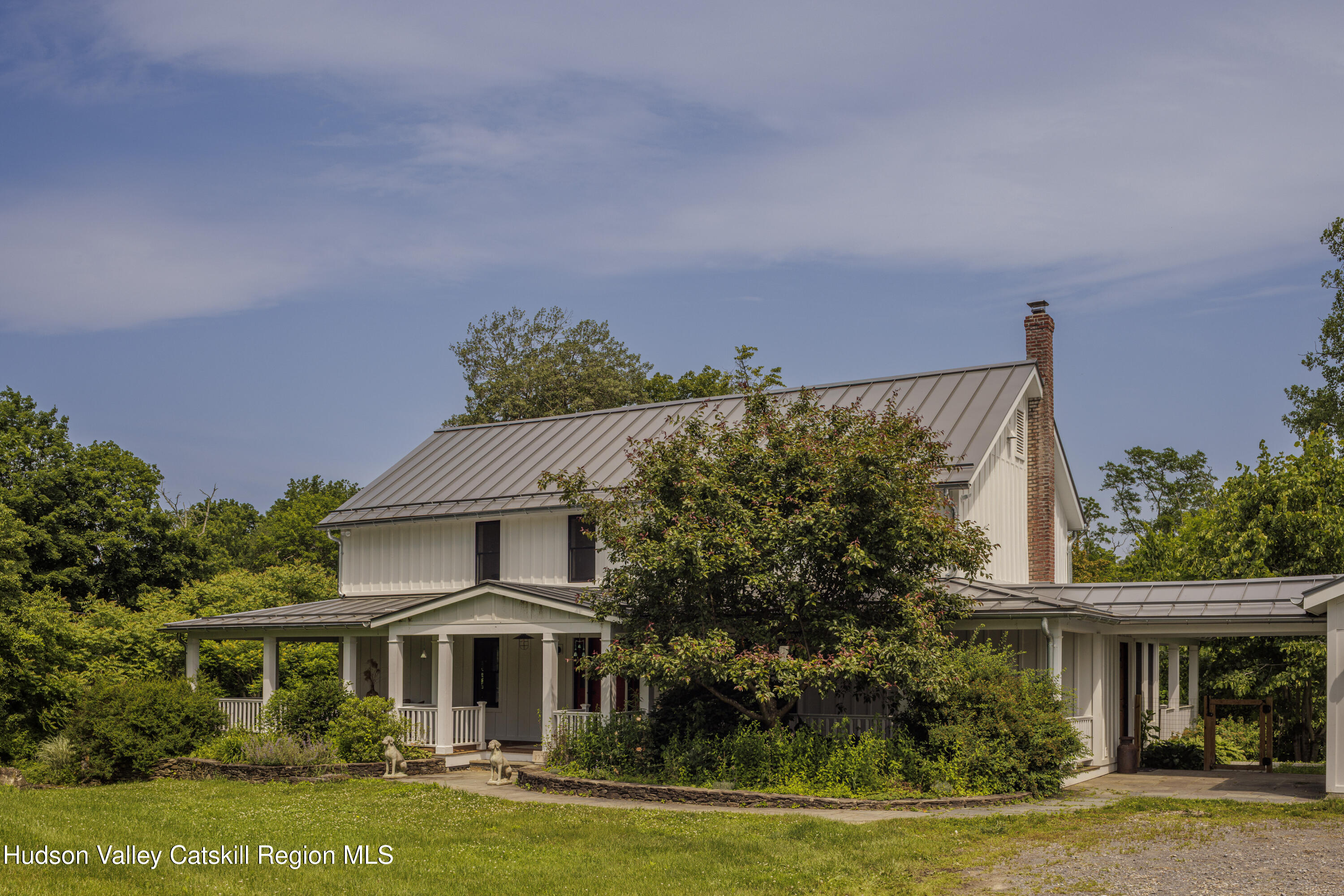 243 Morton Road Rhinebeck, NY 12572 - Photo 30 of 44 a front view of a house with a garden