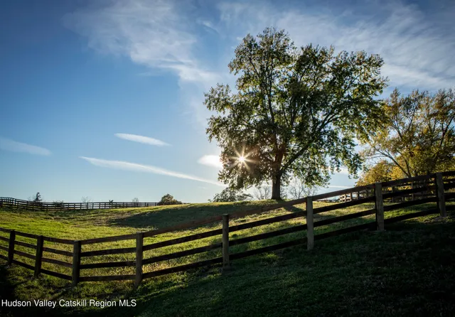 a view of a chairs and table in the balcony