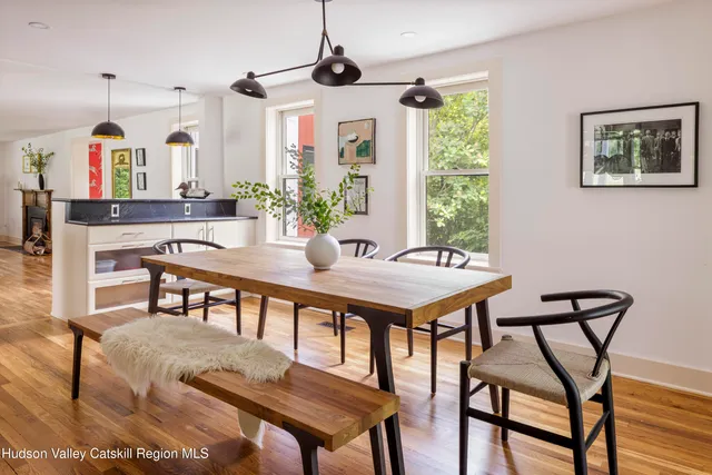 a dining room with furniture and window