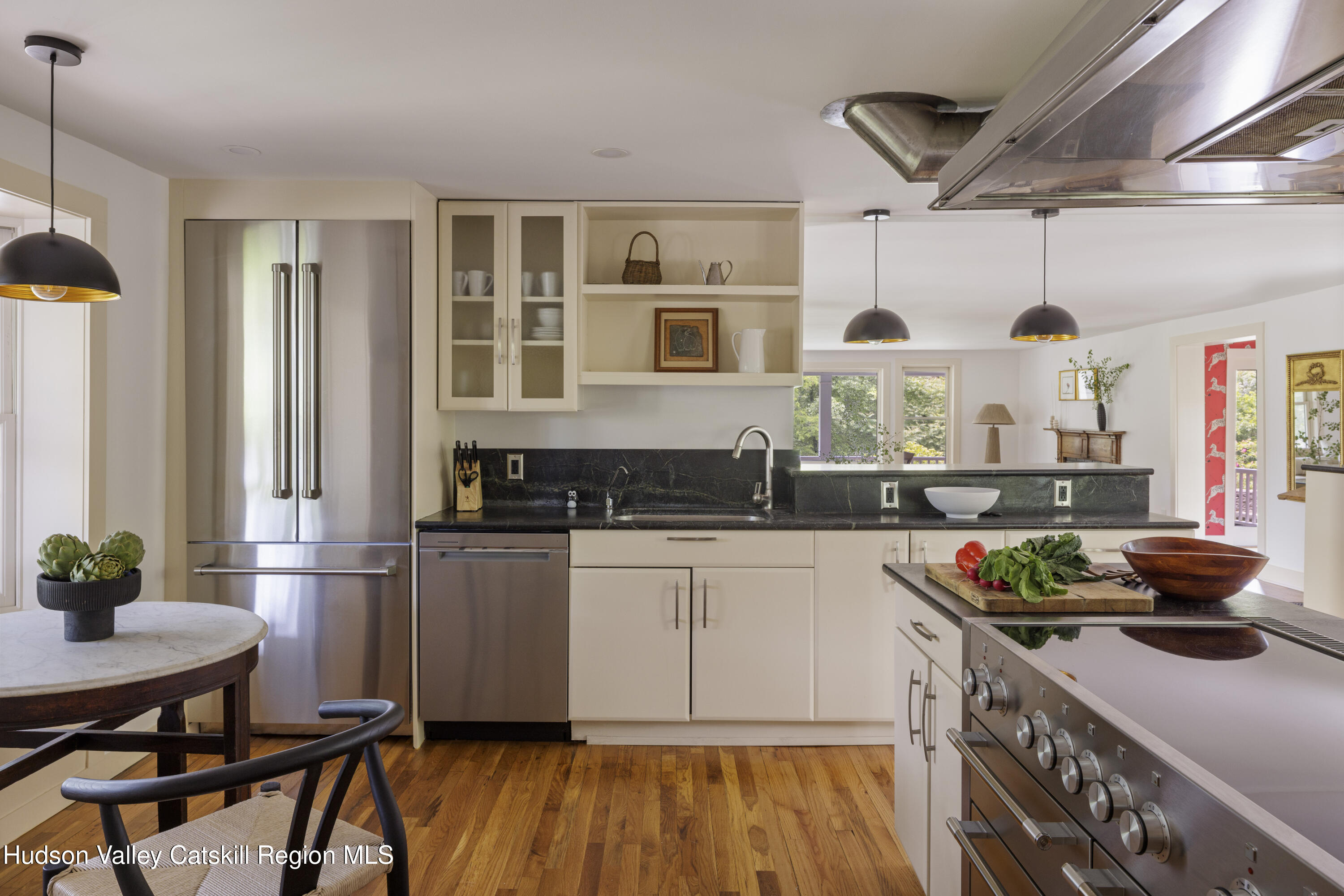 243 Morton Road Rhinebeck, NY 12572 - Photo 8 of 44 a kitchen with stainless steel appliances granite countertop a stove and white cabinets