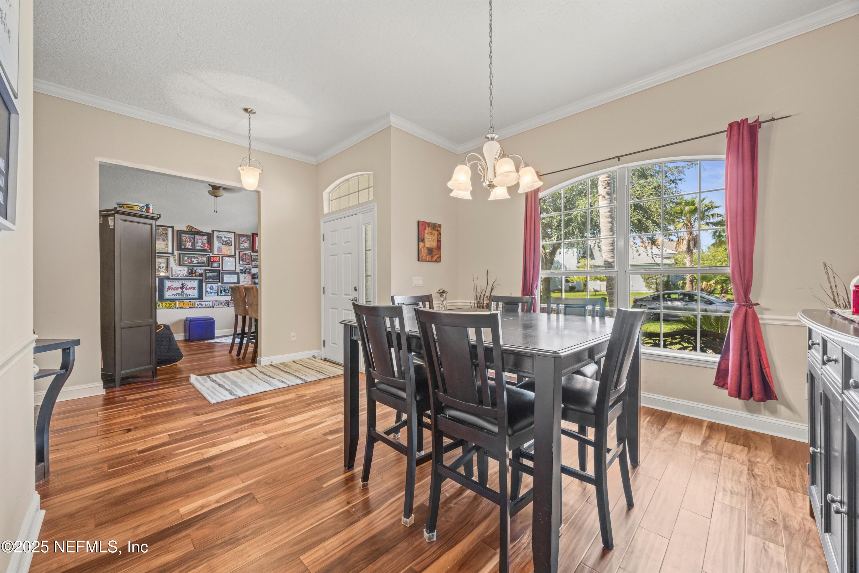 648 Battersea Drive St. Augustine, FL 32095 - Photo 10 of 59 a view of a dining room with furniture window and wooden floor