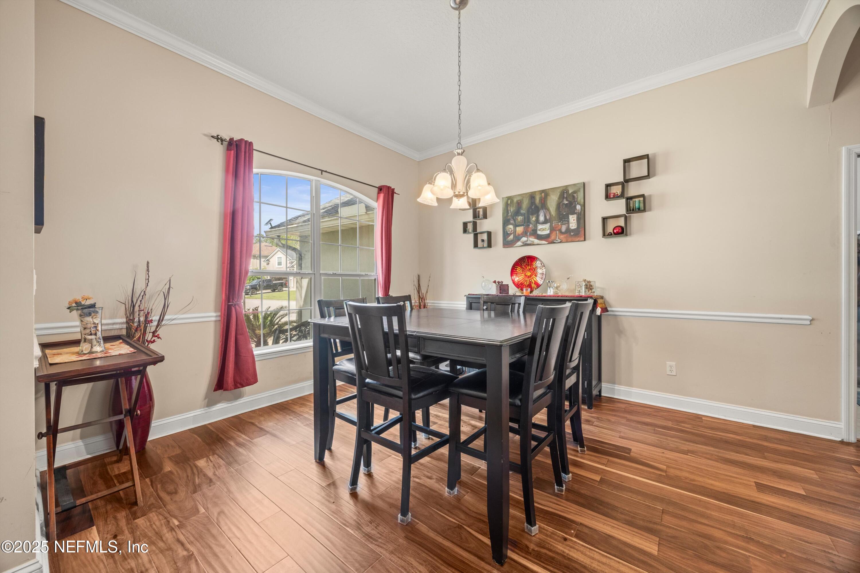 648 Battersea Drive St. Augustine, FL 32095 - Photo 11 of 59 a view of a dining room with furniture window and wooden floor