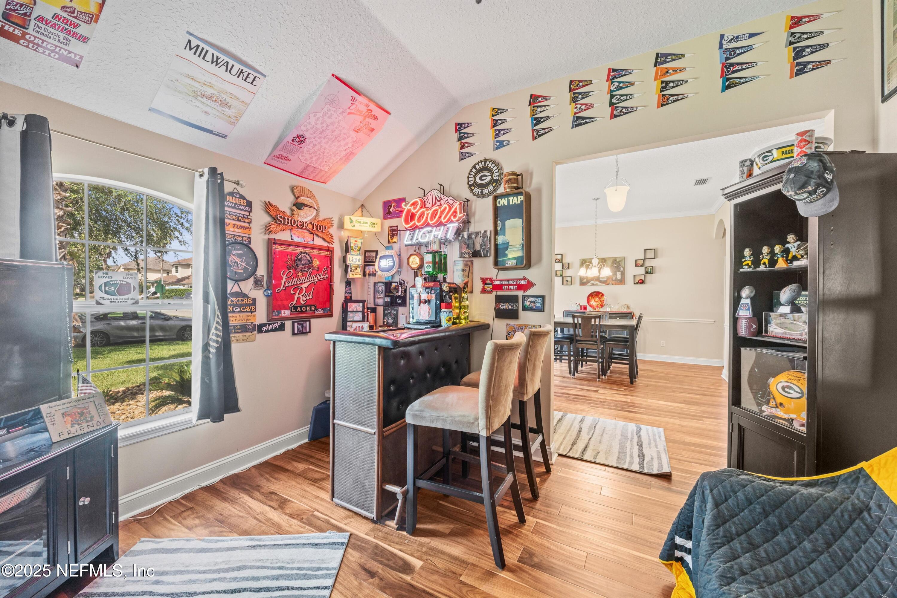 648 Battersea Drive St. Augustine, FL 32095 - Photo 13 of 59 a living room with furniture and a fireplace
