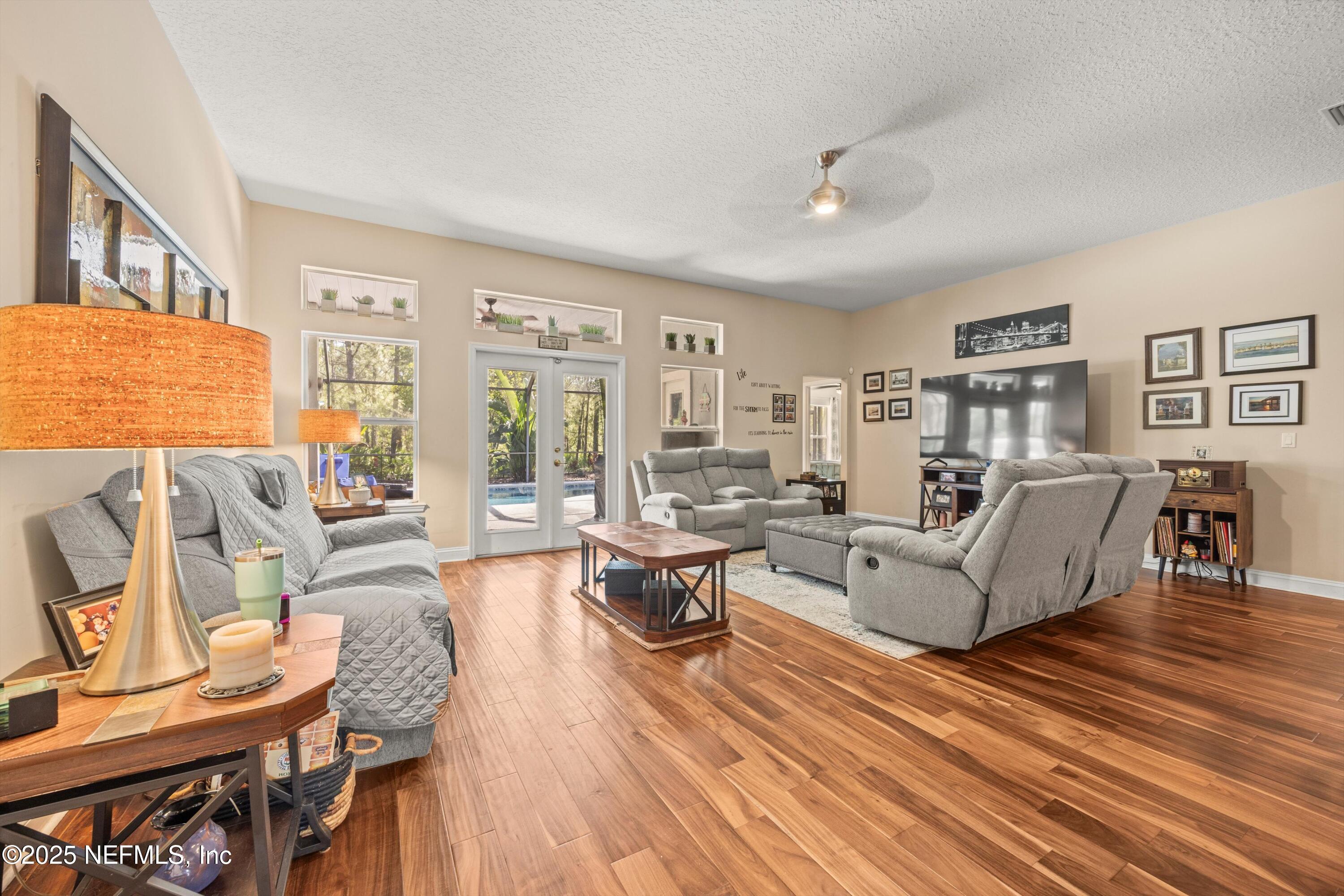 648 Battersea Drive St. Augustine, FL 32095 - Photo 17 of 59 a living room with furniture and wooden floor