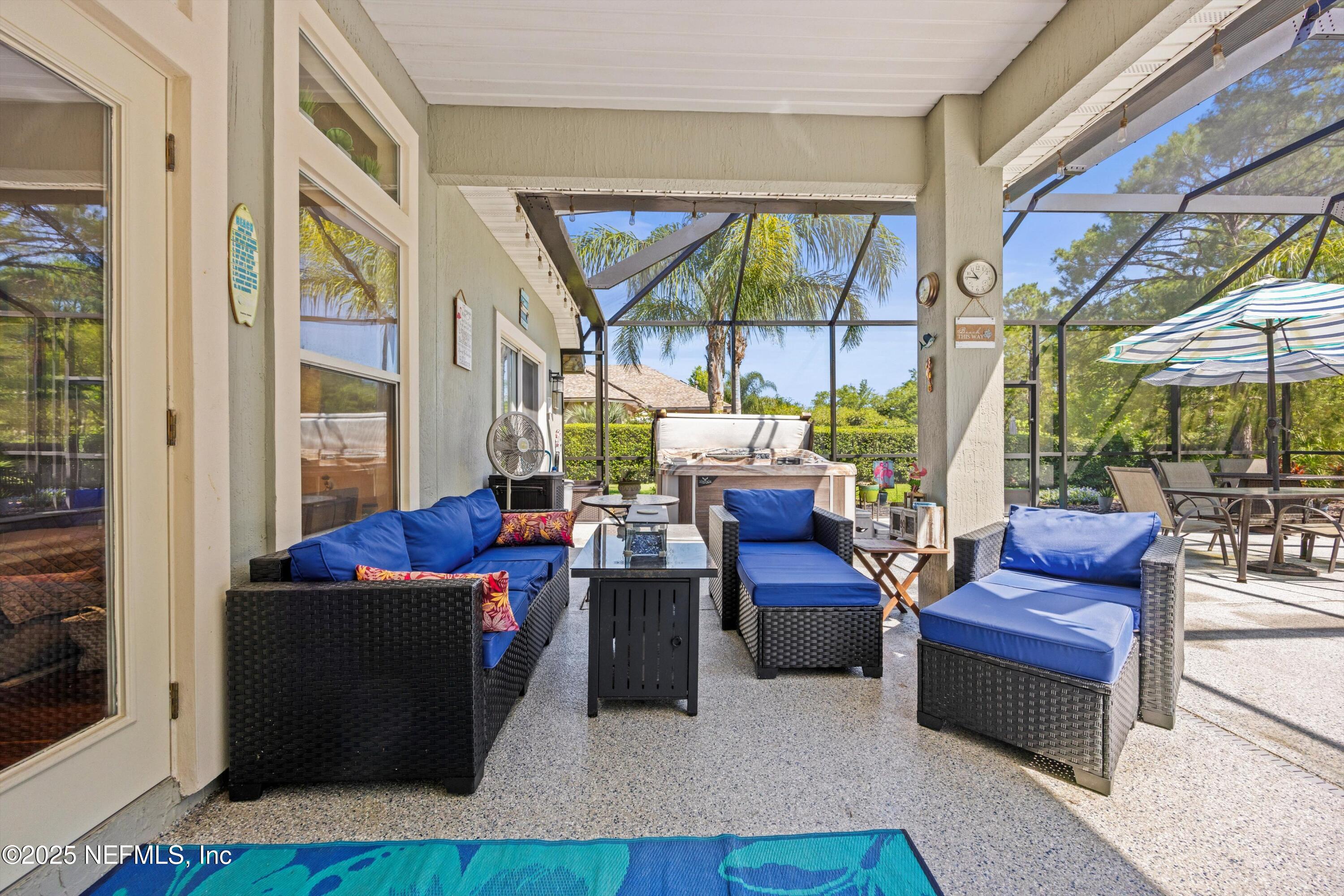 648 Battersea Drive St. Augustine, FL 32095 - Photo 38 of 59 a living room with fireplace furniture and a potted plant