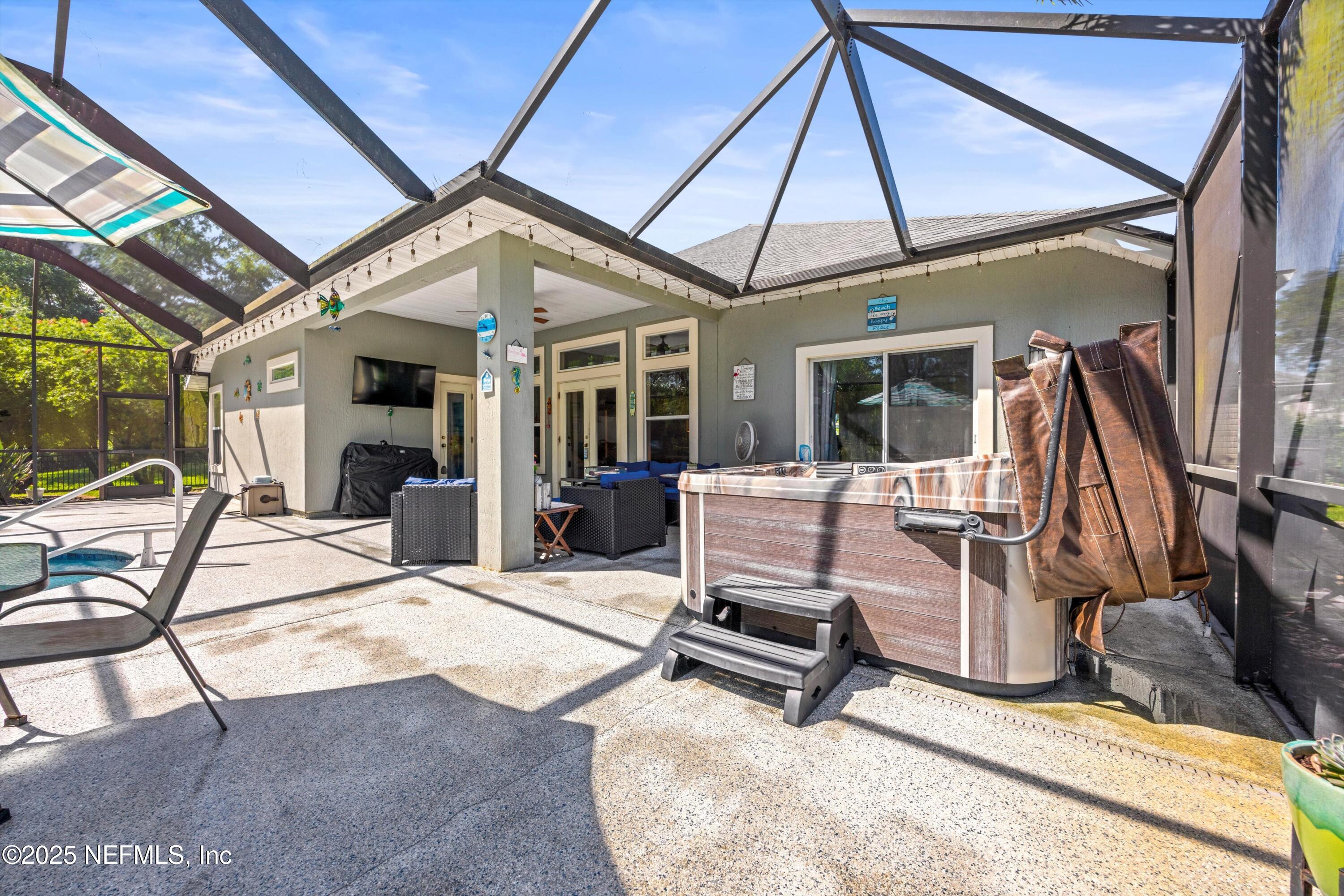 648 Battersea Drive St. Augustine, FL 32095 - Photo 41 of 59 a view of a patio with table and chairs