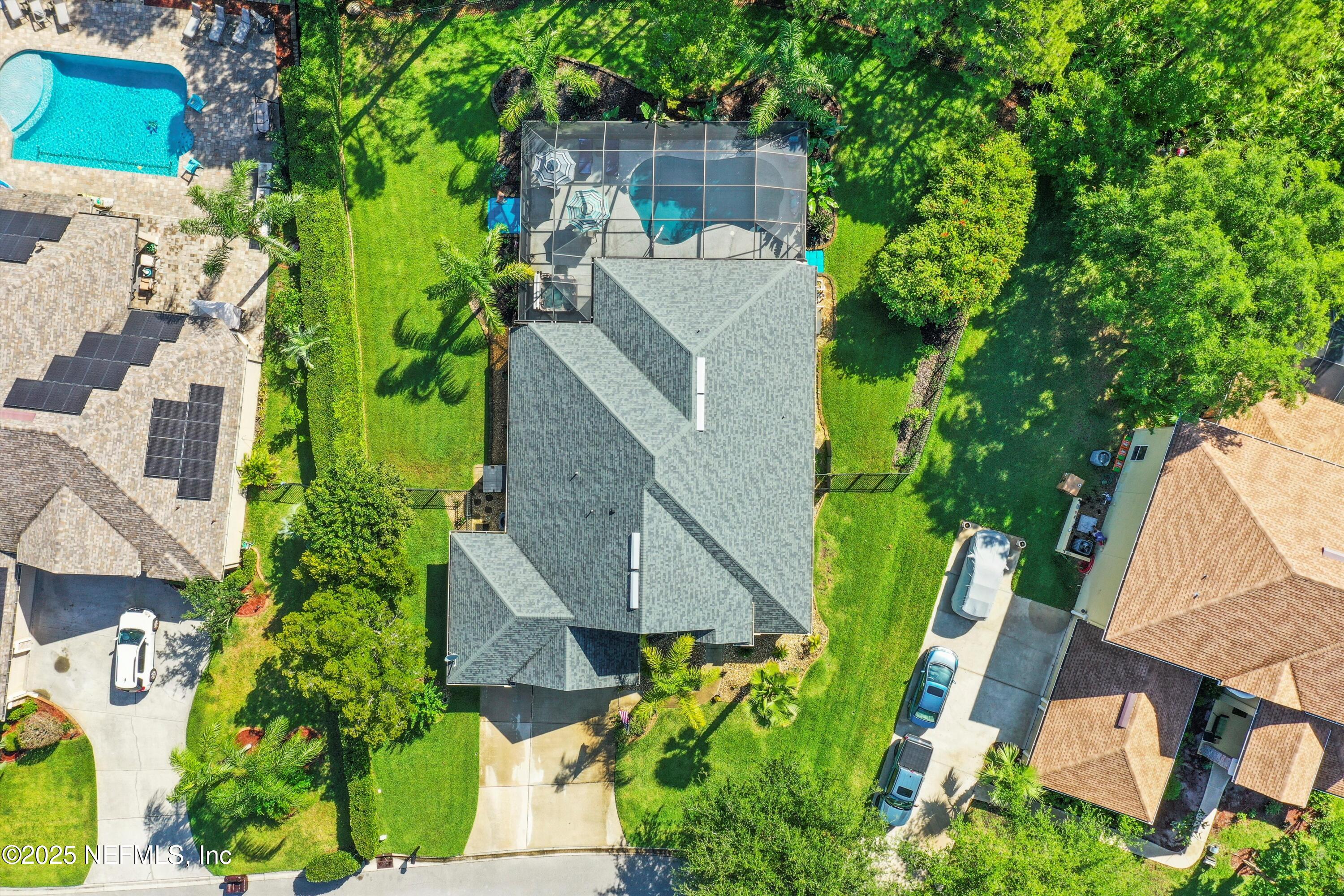 648 Battersea Drive St. Augustine, FL 32095 - Photo 52 of 59 an aerial view of a house with a garden