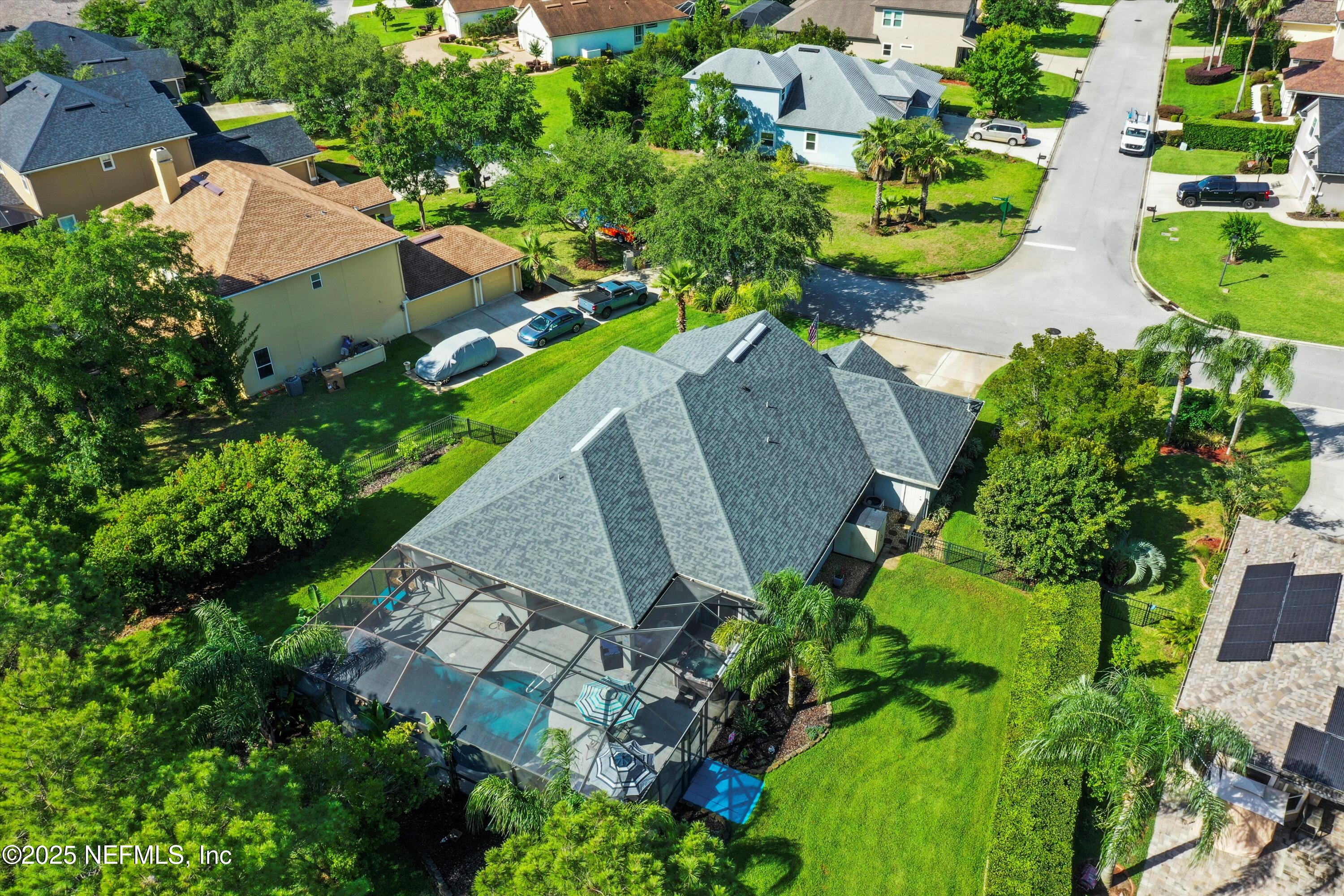 648 Battersea Drive St. Augustine, FL 32095 - Photo 54 of 59 an aerial view of a house with a yard and garden