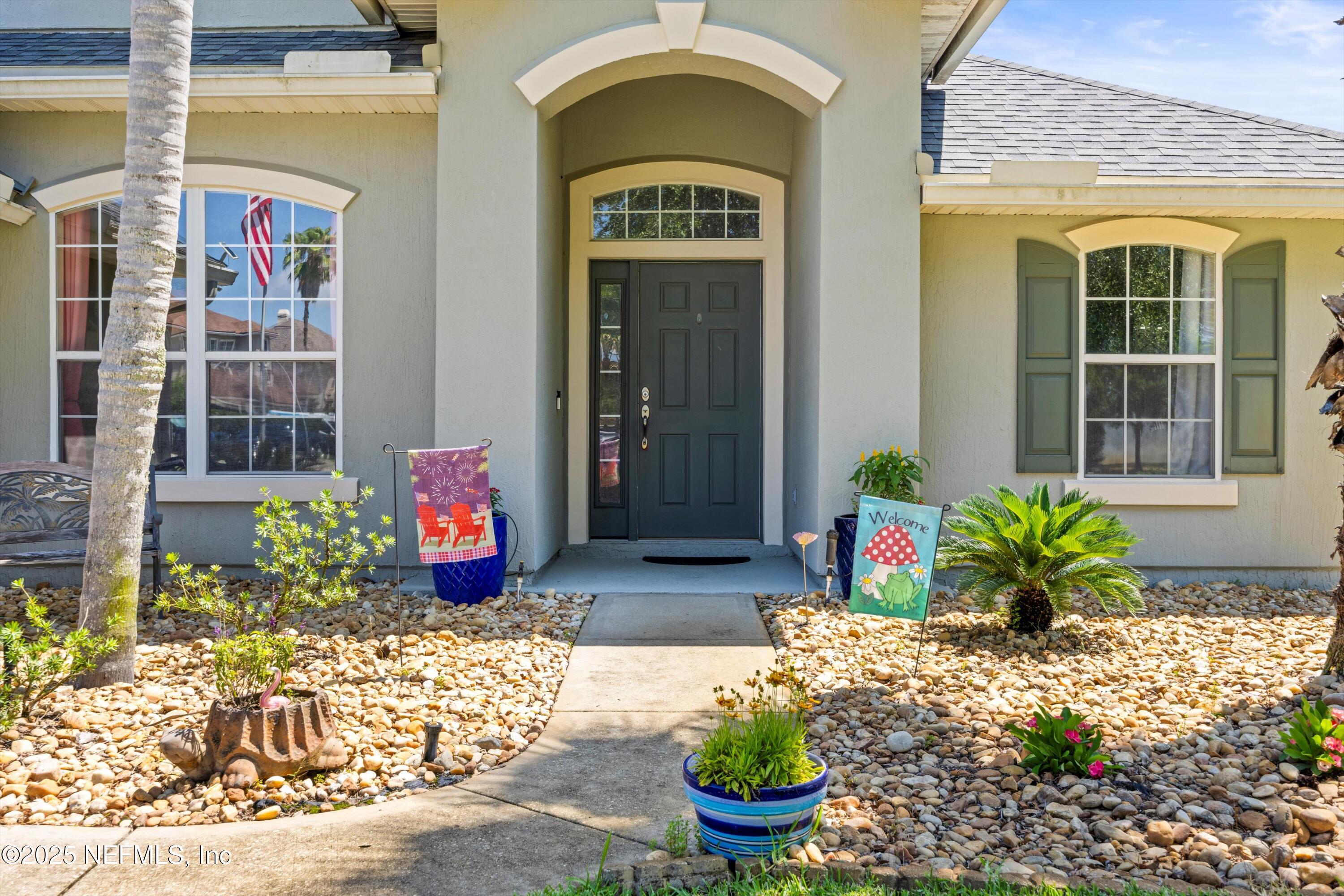648 Battersea Drive St. Augustine, FL 32095 - Photo 7 of 59 a front view of a house