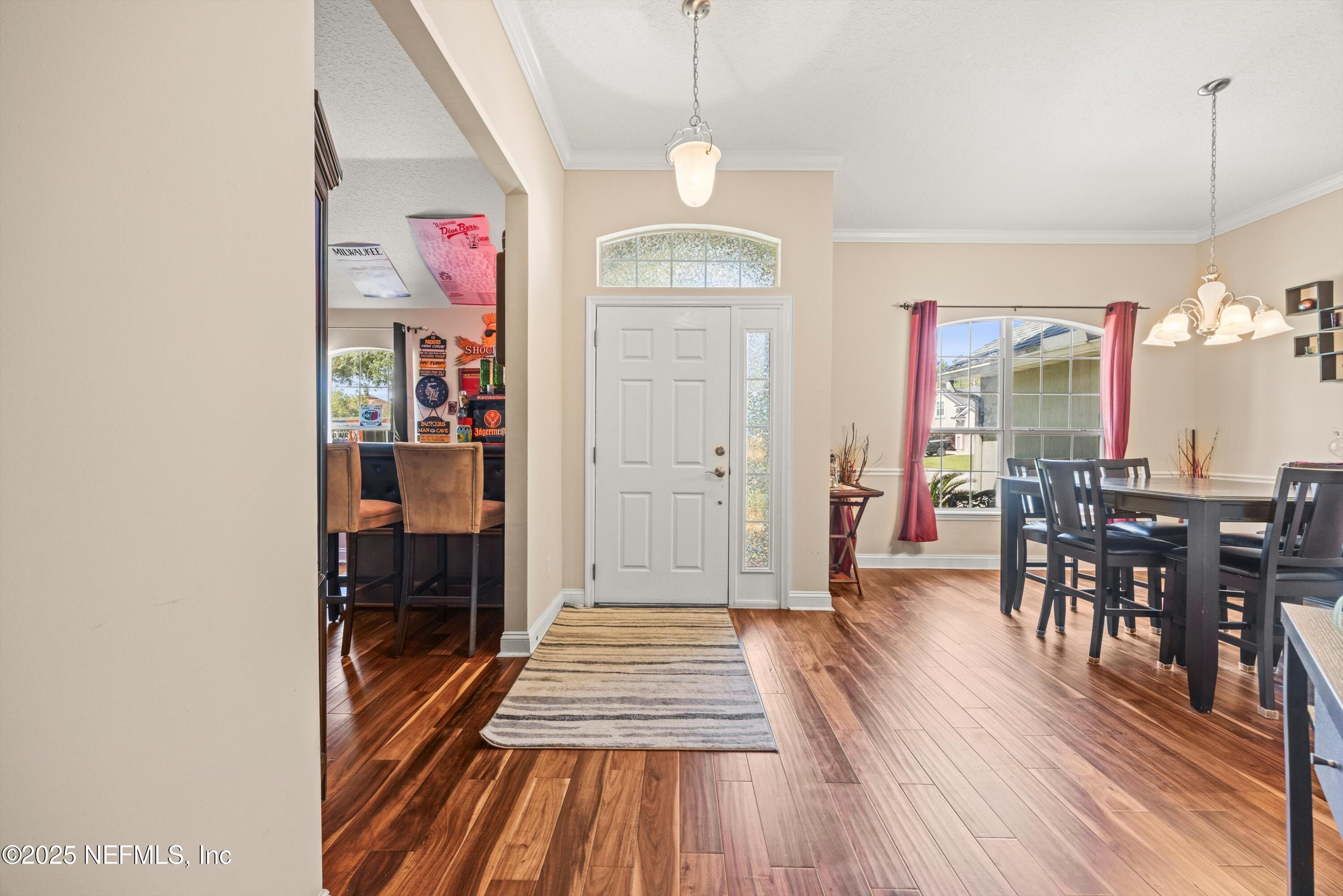 648 Battersea Drive St. Augustine, FL 32095 - Photo 9 of 59 a view of a room with furniture and wooden floor